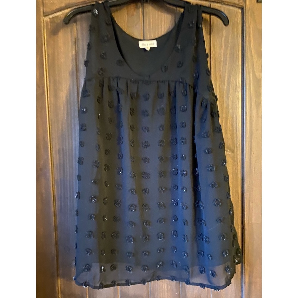 Medium black Swiss dot sleeveless blouse